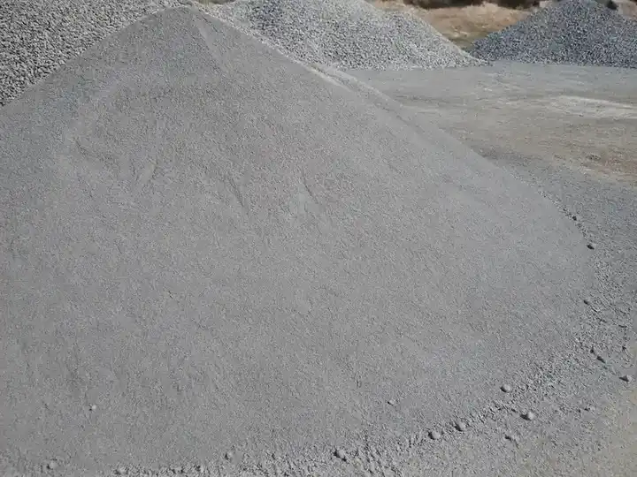 Fine gray stone dust in a quarry stockpile